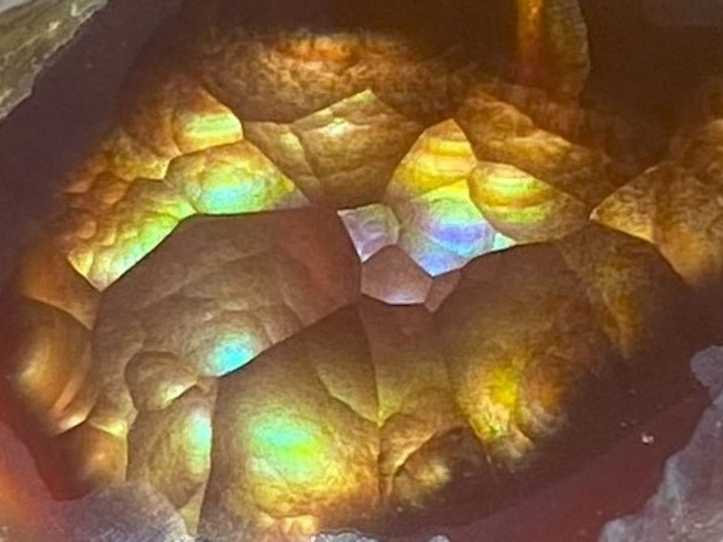 Close-up of a colorful Aguascalientes Fire Agate Specimen with iridescent properties