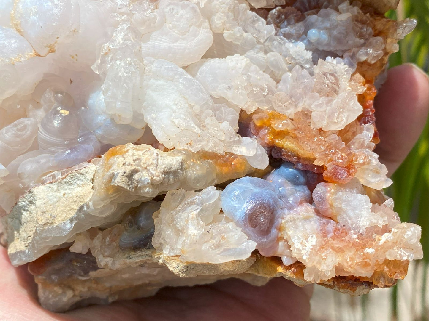 Close-up of a Slaughter Mountain fore agate specimen with crystal and chalcedony formations with various colors.