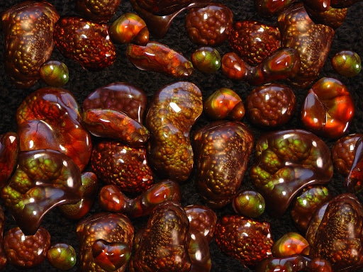Close-up of fire agate gemstones with a dark background