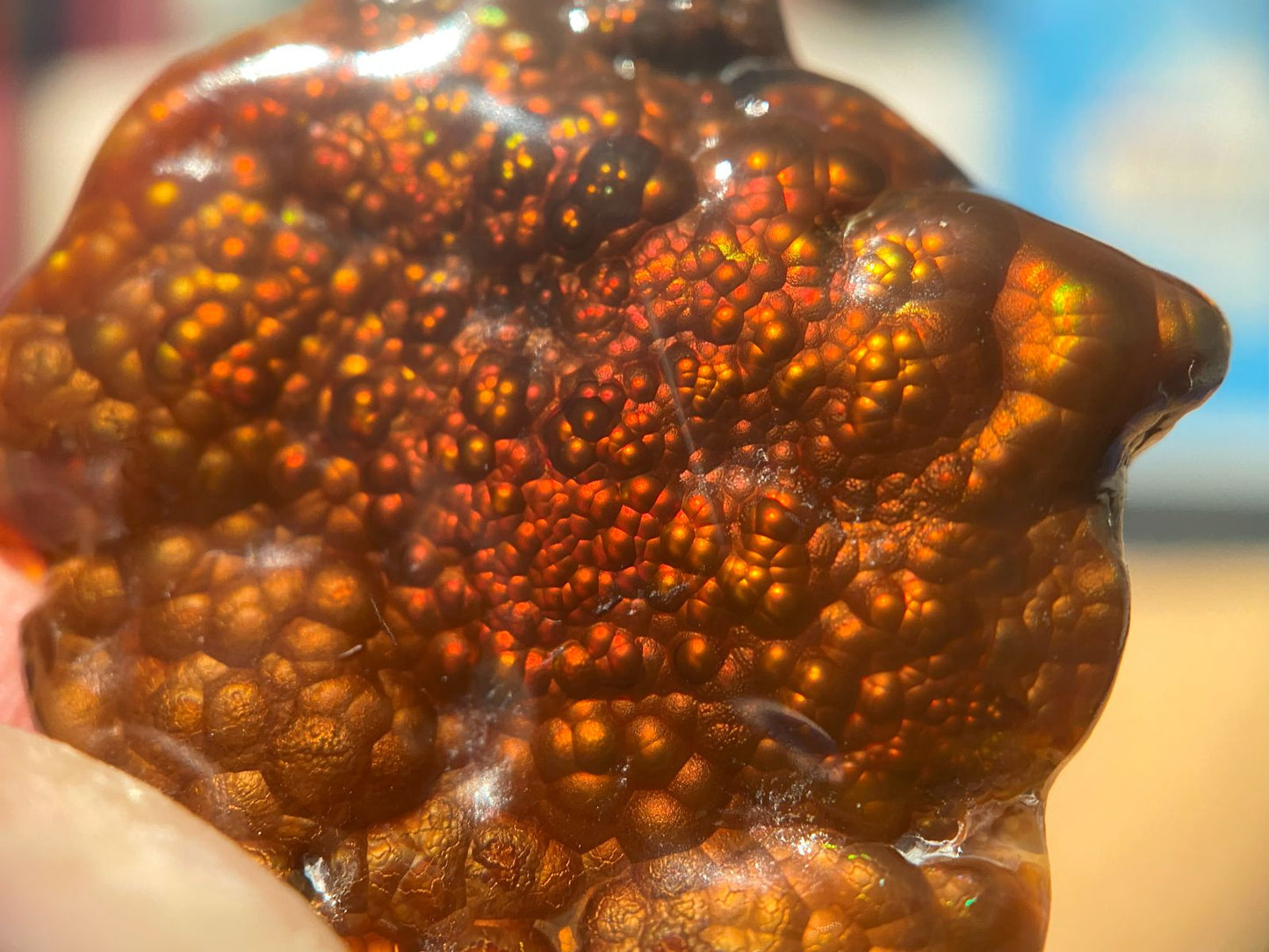 Close-up of a Fire Agate Gemstone with a blurred background