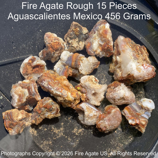 Fire Agate Rough from Aguascalientes, Mexico on a dark surface