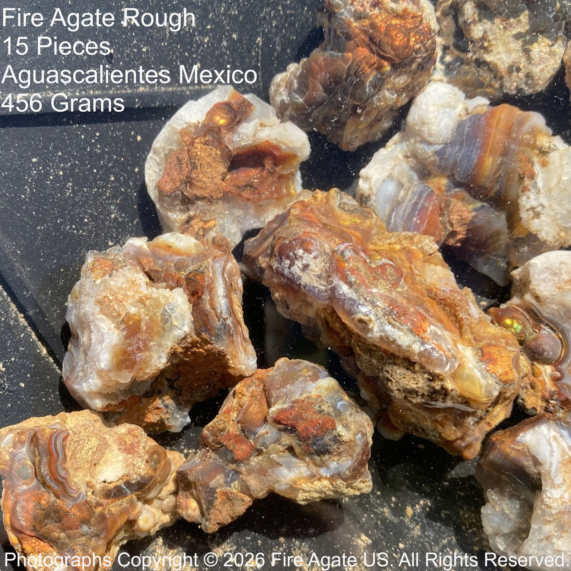 Fire Agate Rough pieces from Aguascalientes, Mexico on a dark background
