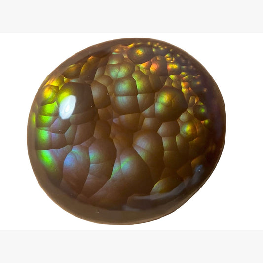 a round iridescent Aguascalientes Fire Agate Gemstone with a multicolored pattern on a white background