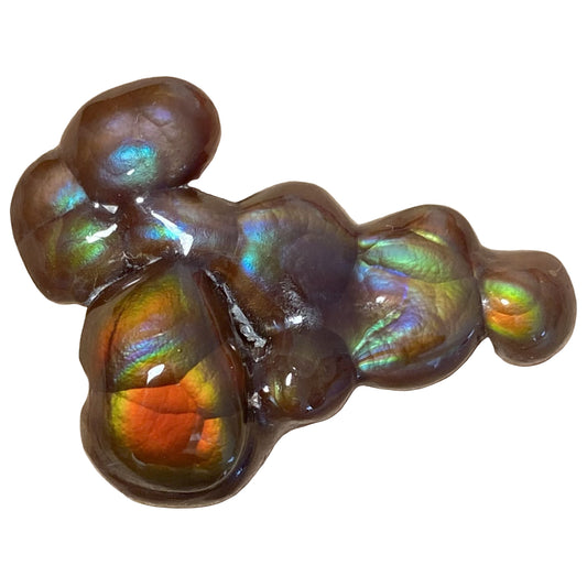 Multicolored Aguascalientes Fire Agate Gemstone with iridescent sheen on a white background