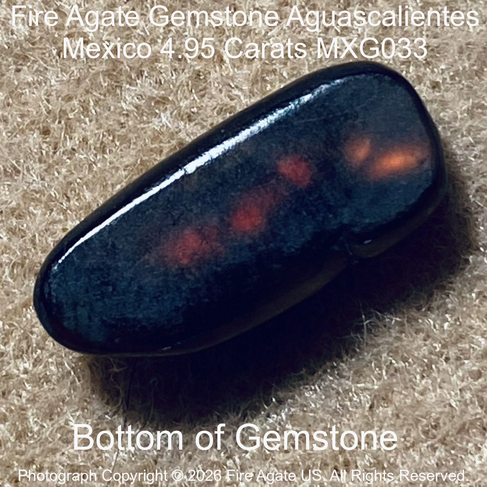 A polished Fire Agate gemstone with a dark body and orange-red internal inclusions, shown on a textured beige background with text overlays.