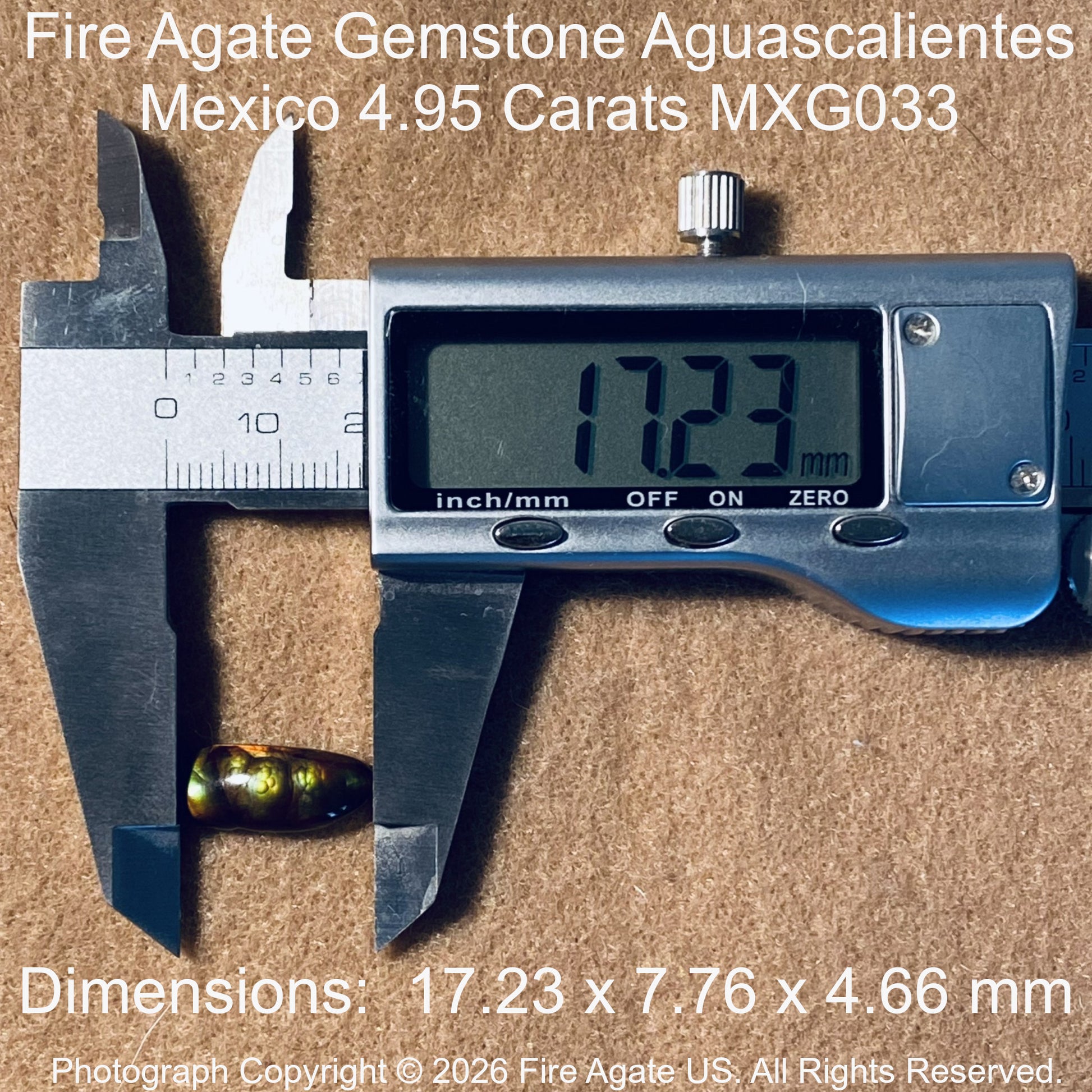 A small round gemstone labeled Fire Agate is shown under a digital caliper displaying 17.23 mm.