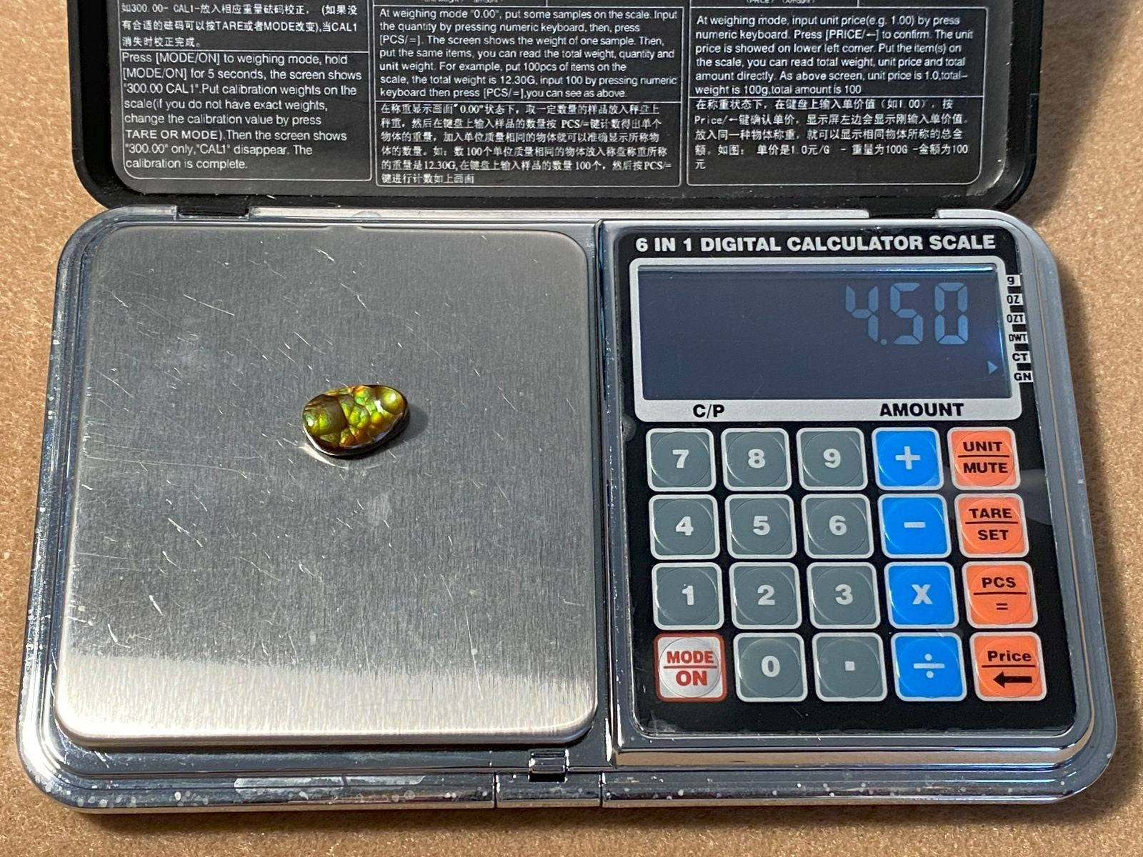 Aguascalientes fire agate on scale showing a weight of 4.5 carats