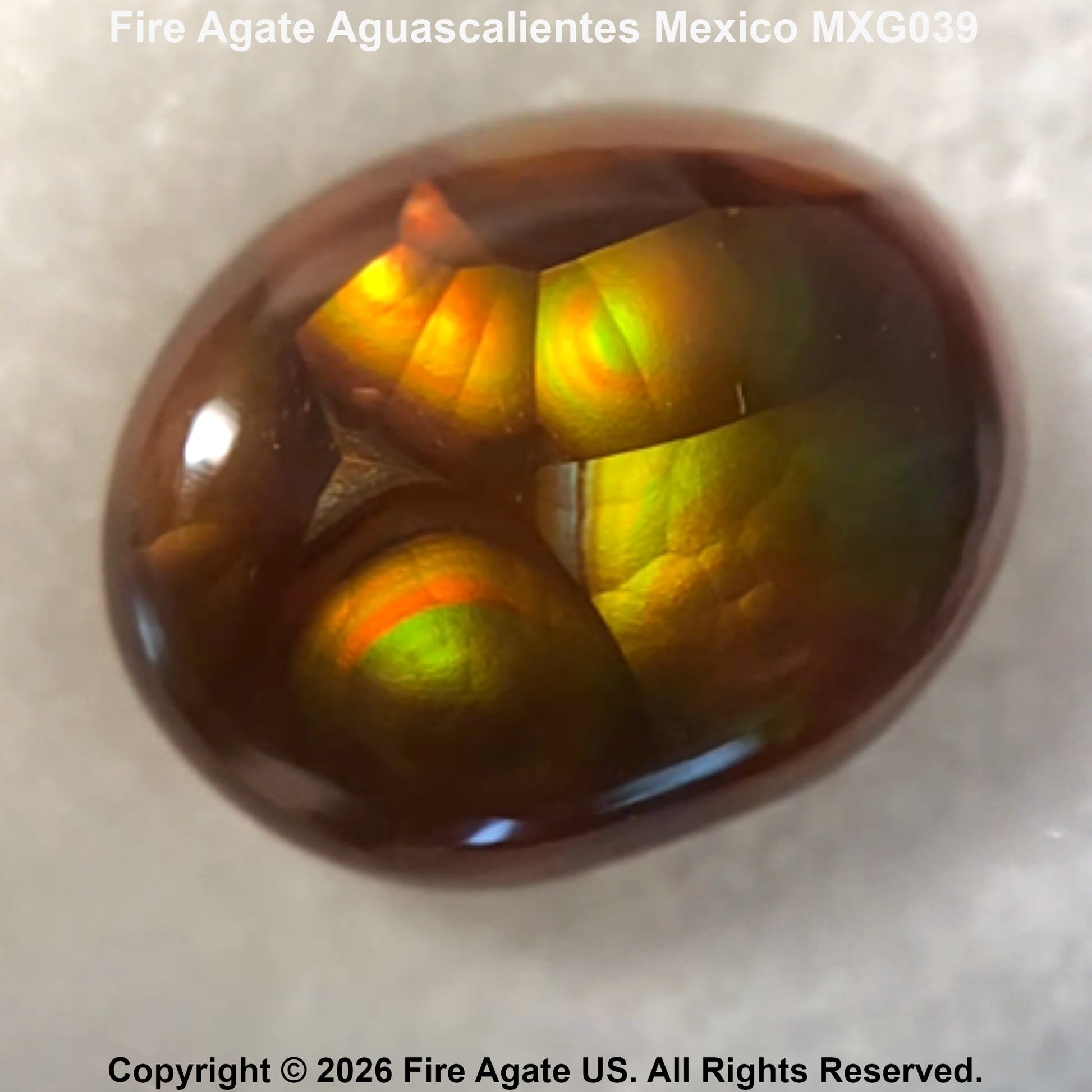A polished oval Fire Agate gemstone showing vibrant internal flashes of yellow, green, and orange, set against a light textured background with text overlays.