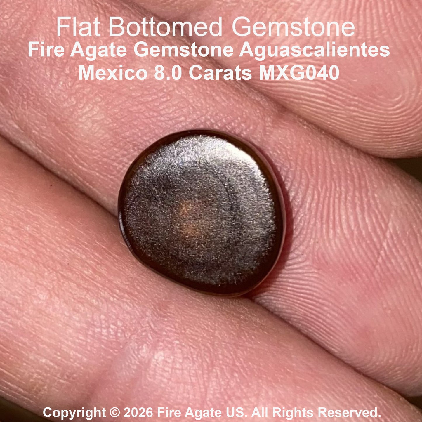 A close up of a flat bottomed fire agate gemstone resting on a person's fingers, with text overlay identifying it as 'Flat Bottomed Gemstone Fire Agate Gemstone Aguascalientes Mexico 8.0 Carats MXG040'.