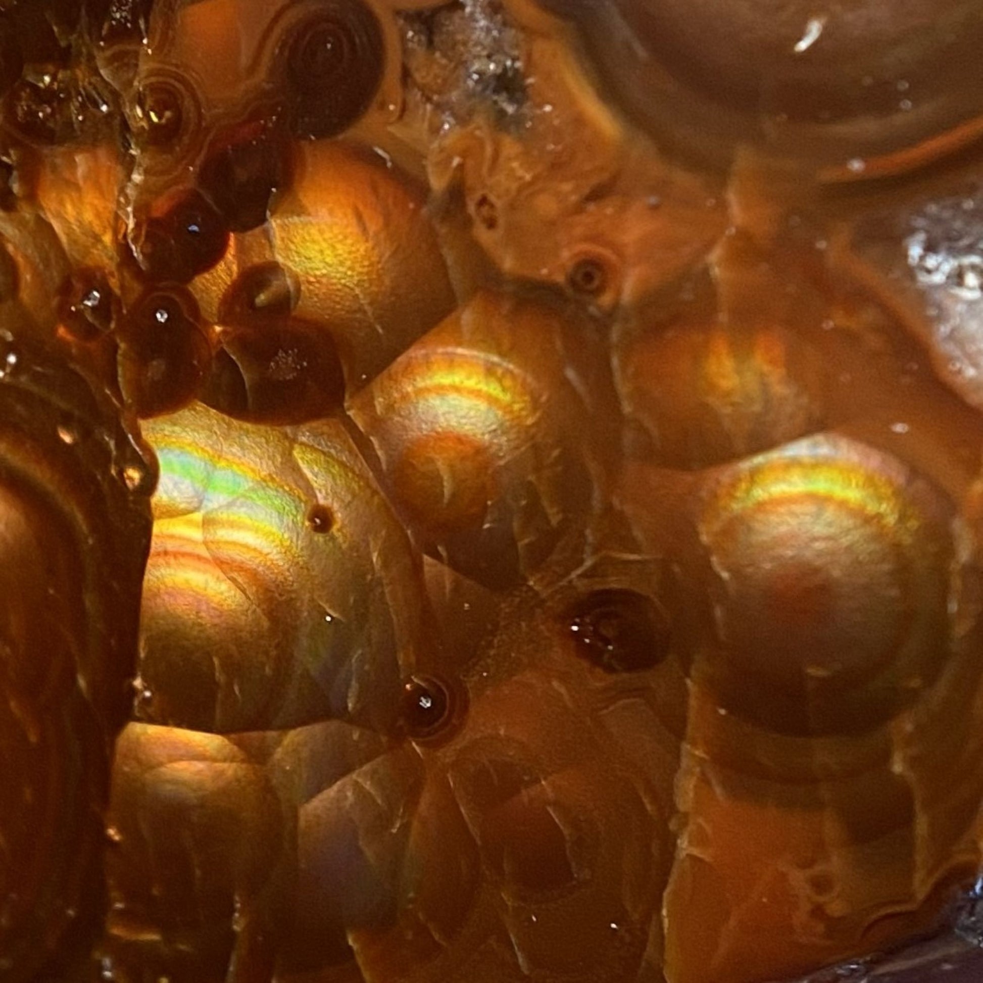 Close-up of a textured fire agate surface with orange and brown colors
