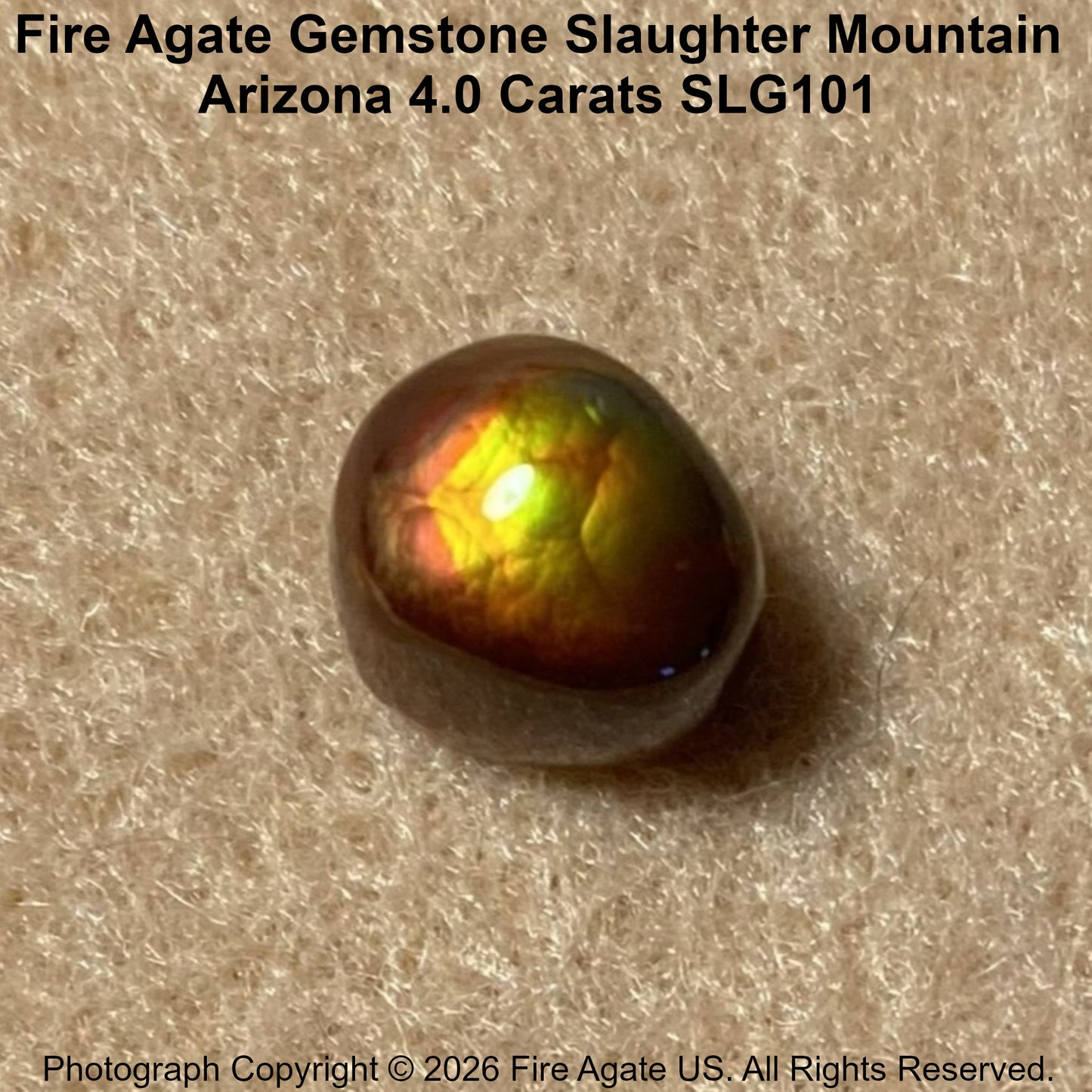A 4.0 carat fire agate gemstone with a polished, glossy finish, displaying vibrant iridescent flashes of yellow, green, orange, and red on a textured beige background.