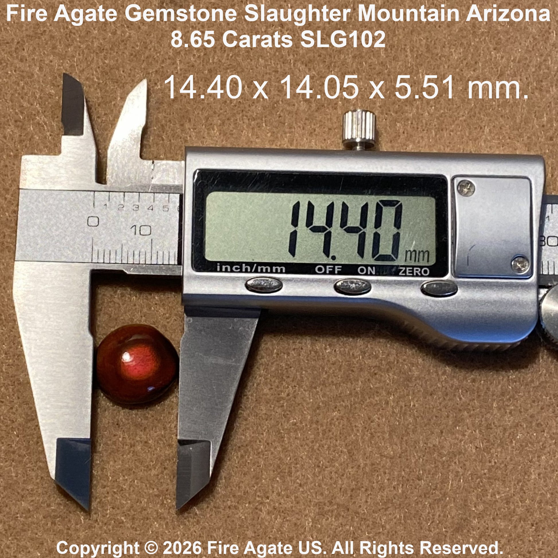A red fire agate gemstone shown under a digital caliper displaying 14.40 mm, with text overlays showing the dimensions and brand copyright information on a brown textured background.
