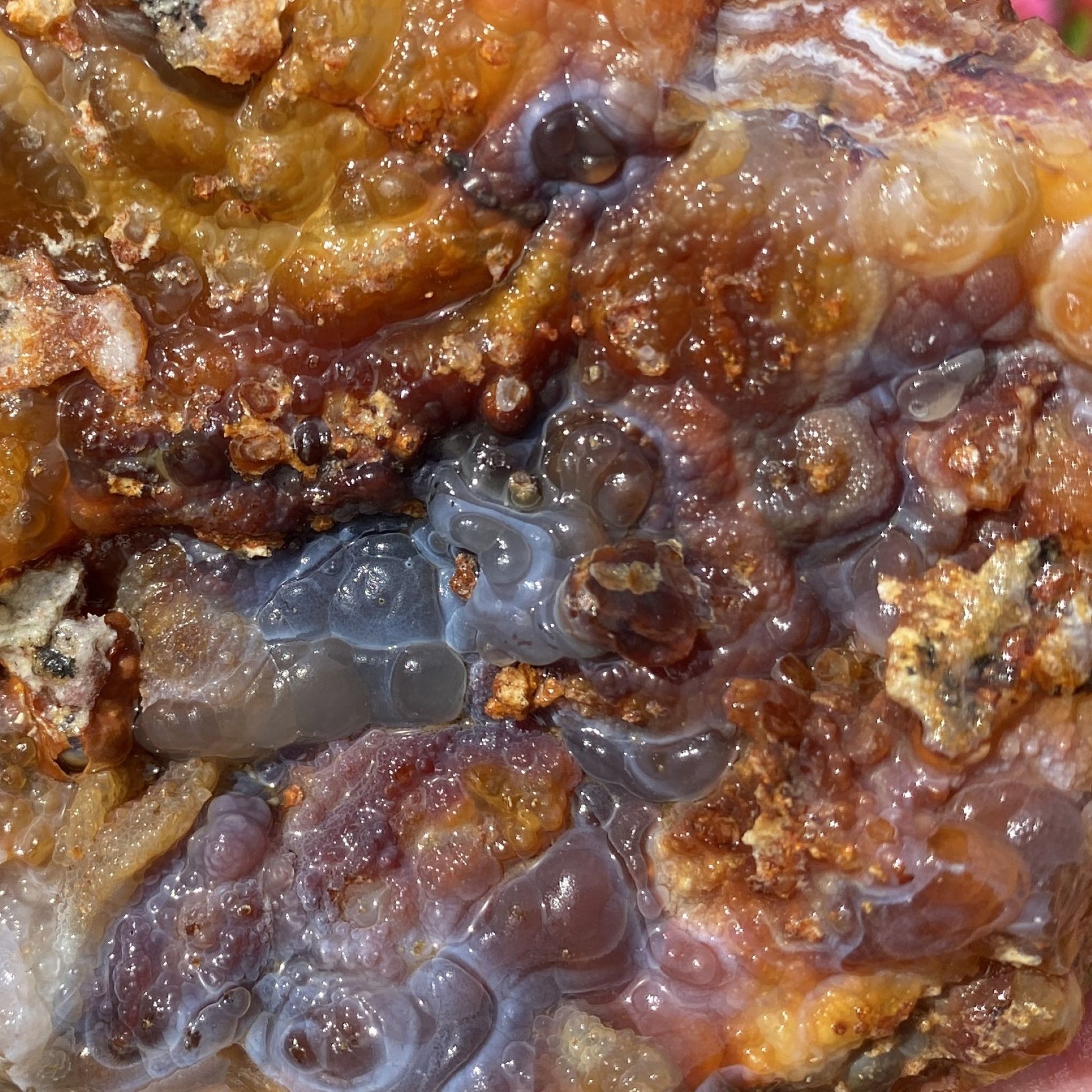 Close-up of a Slaughter Mountain Fire Agate Rough Mineral Specimen with translucent and opaque minerals
