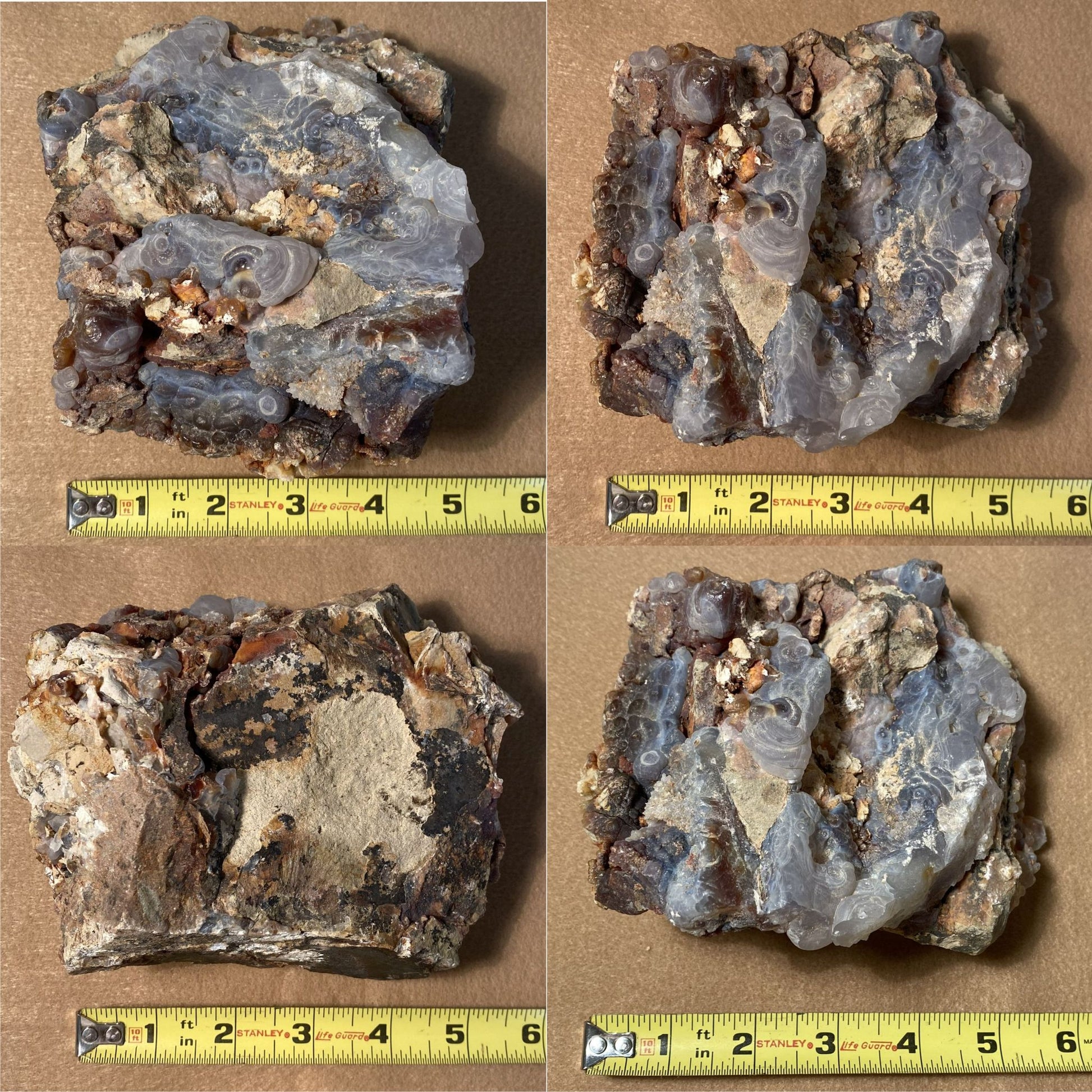 Four Slaughter Mountain Arizona Fire Agate Rough Mineral Specimen rock samples with a measuring tape for scale on a brown background