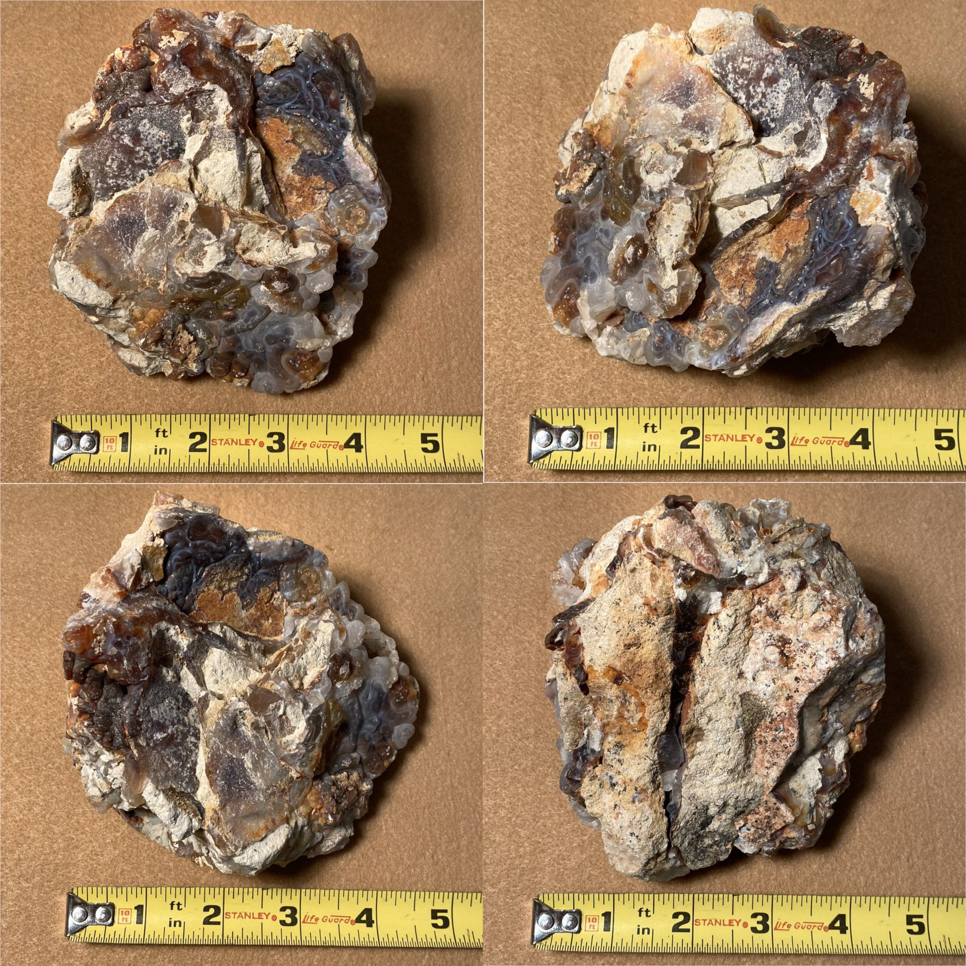 Four fire agate rock samples with a measuring tape for scale on a brown background