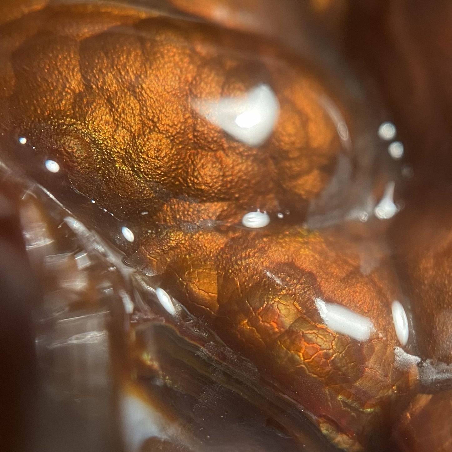 Close-up of a Slaughter Mountain preform fire agate gemstone with detailed texture